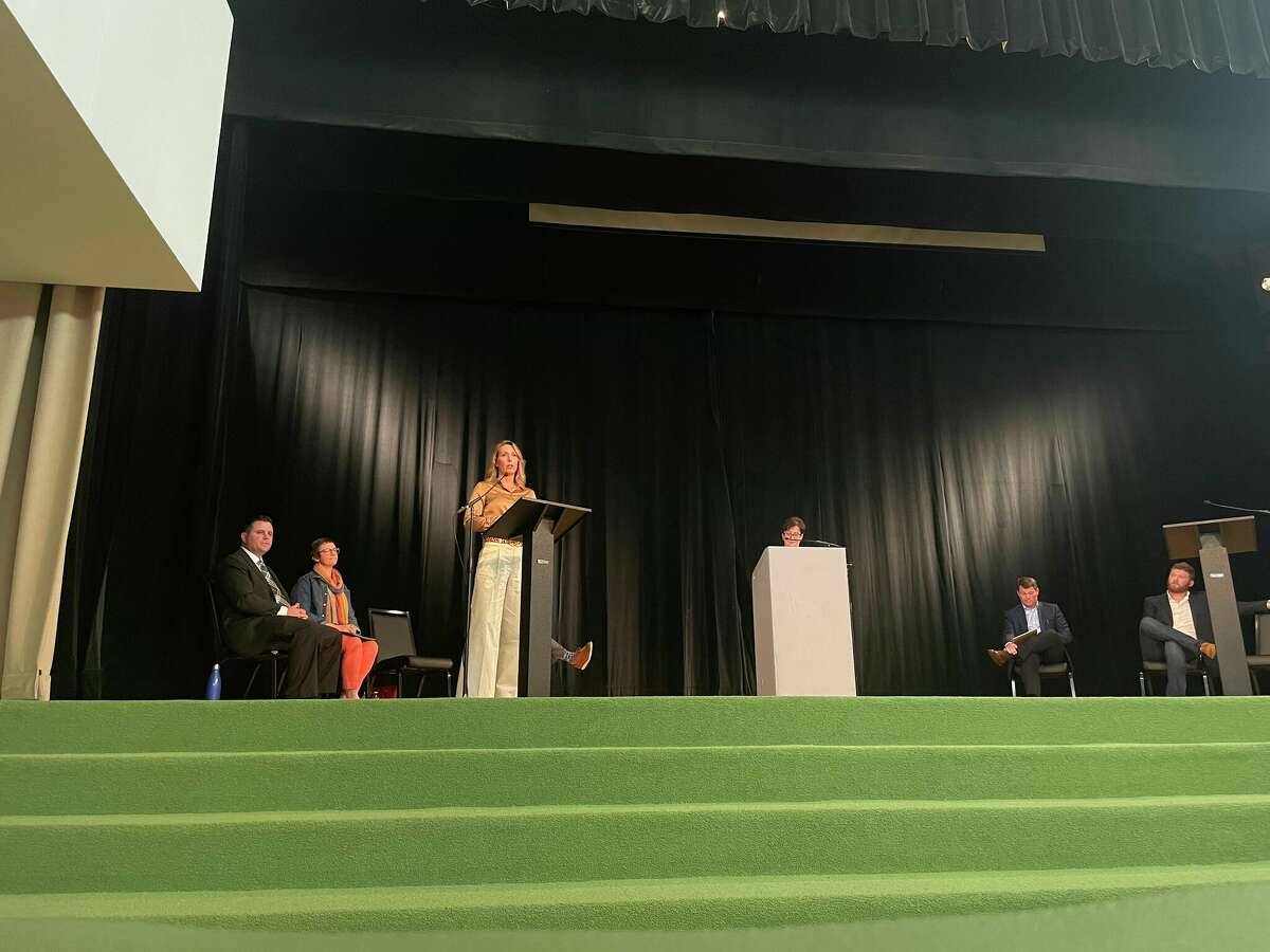 Public School Midland resident Sara Ladwein answers questions during a forum for Midland <a class=
