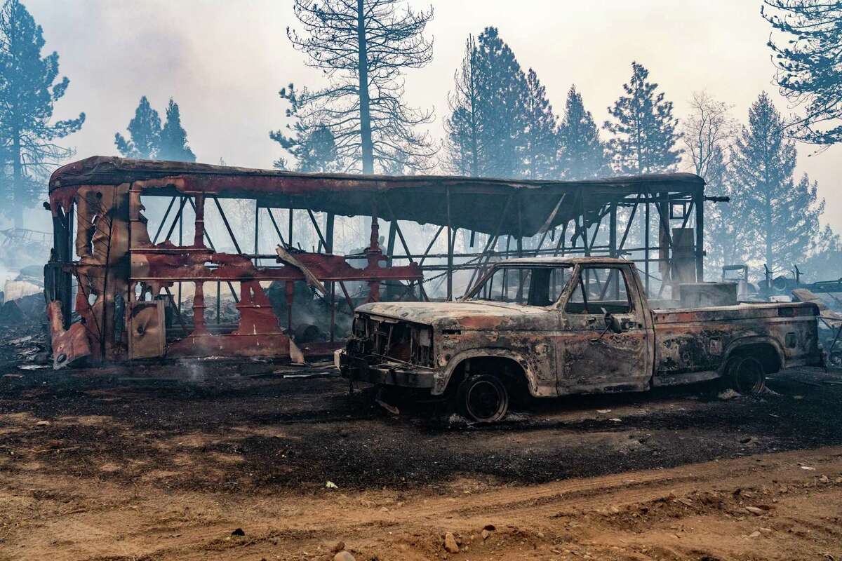 Devastation after flames from the Mosquito Fire jumped the Middle Fork of the American River burning vehicles in Foresthill, Calif. Human remains were found in an area evacuated, but ultimately spared, by the Mosquito Fire, officials said. l
