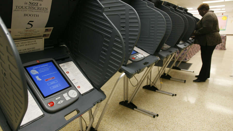 Electronic voting is used at Sunnyside Multi-Service Center during early voting on April 6, 2006 in Houston, TX. Democratic and Republican primary runoffs are Tuesday. Mayra Beltran / Houston Chronicle