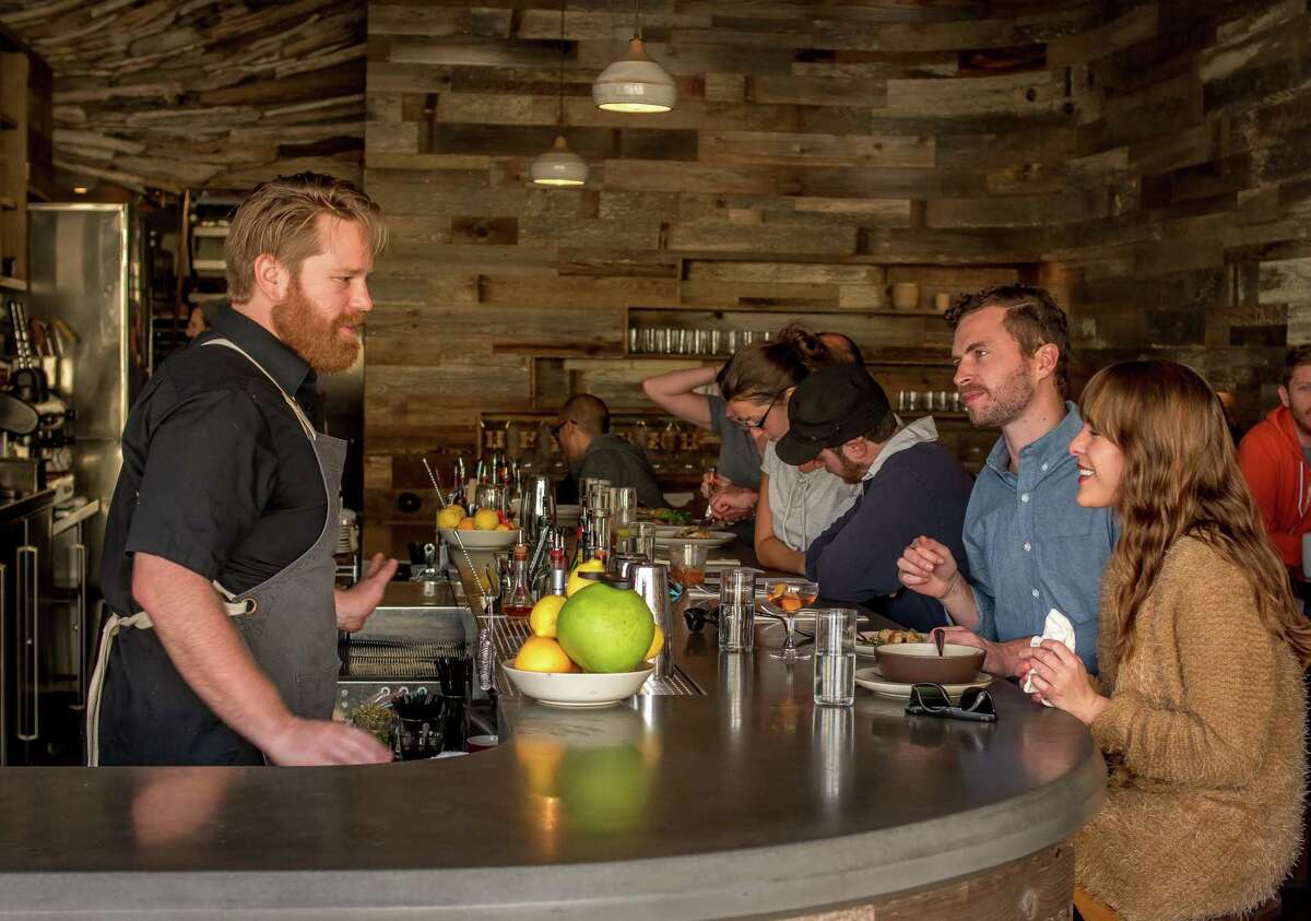 Outerlands bartender Jeremy Lucca-Flaherty talks to customers in 2014. He took the new owner back to the Outer Sunset restaurant.