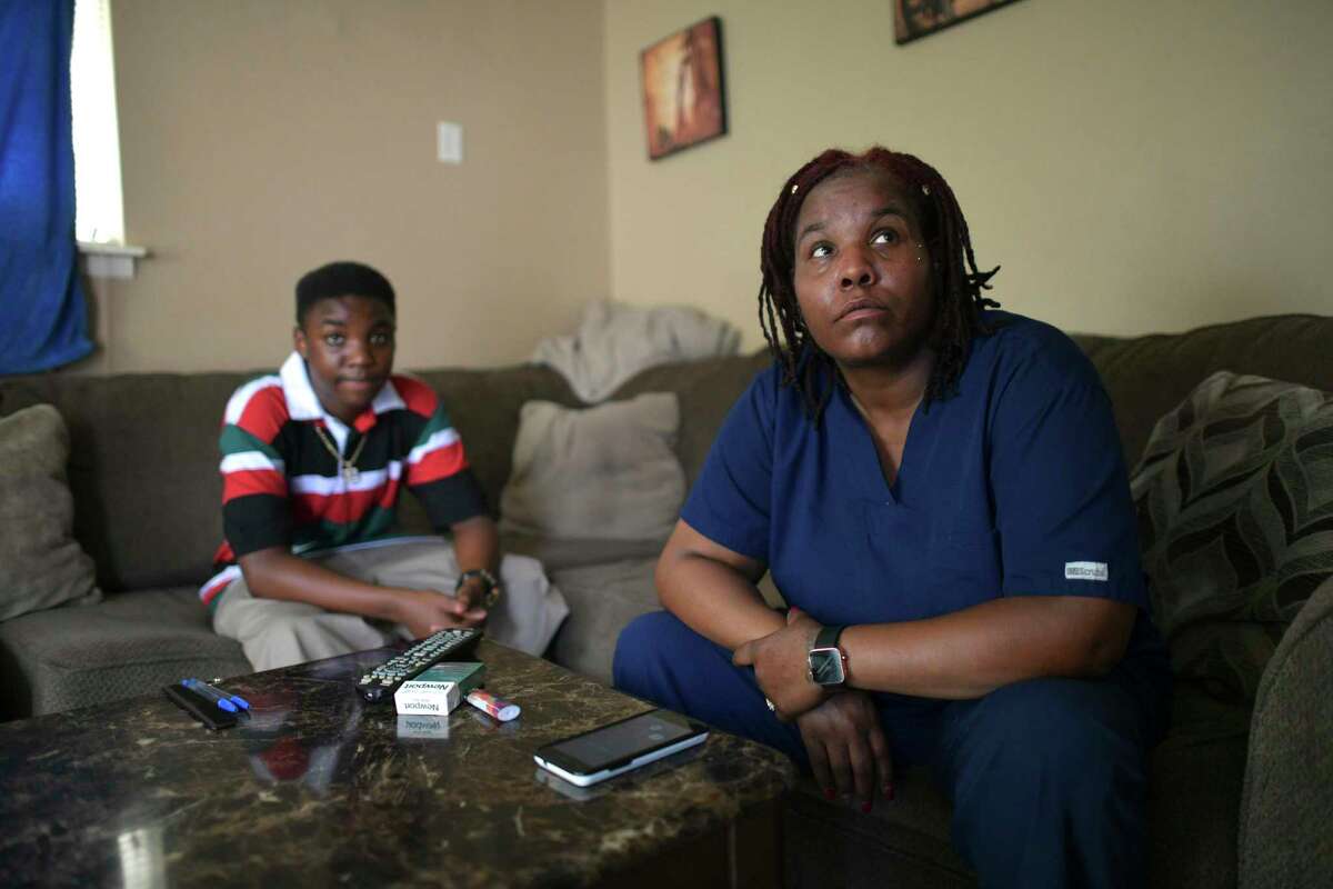 In 2020, Arailia Jeffries listens with her son as a Spectrum representative tells her over the phone she cannot get connected to free internet service because she owes money. More than 20 percent of our neighbors in San Antonio and Bexar County face barriers to accessing the internet, but SA Digital Connects is working toward solutions.