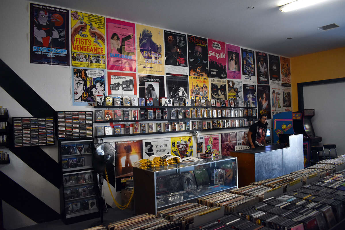 Miguel Hiracheta mans the counter at Going Underground Video a new store in Bakersfield dedicated to out-of-print and hard-to-find classic VHS movies along with music and video games.