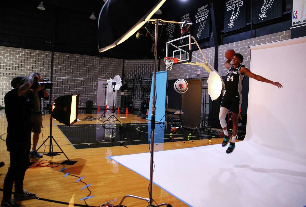Spurs’ Devin Vassell (24) gets his photo taken as the Spurs hold their 2022-23 Media Day at their practice facility on Monday, Sept. 26, 2022.