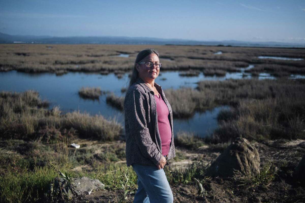 Jennifer Kalt, the director of Humboldt Baykeeper, outside of the former Sierra Pacific industries mill in Arcata. The mill is one of dozens that one stood around Humboldt Bay and many have left contaminated soil and groundwater that could mobilize once sea level rises.