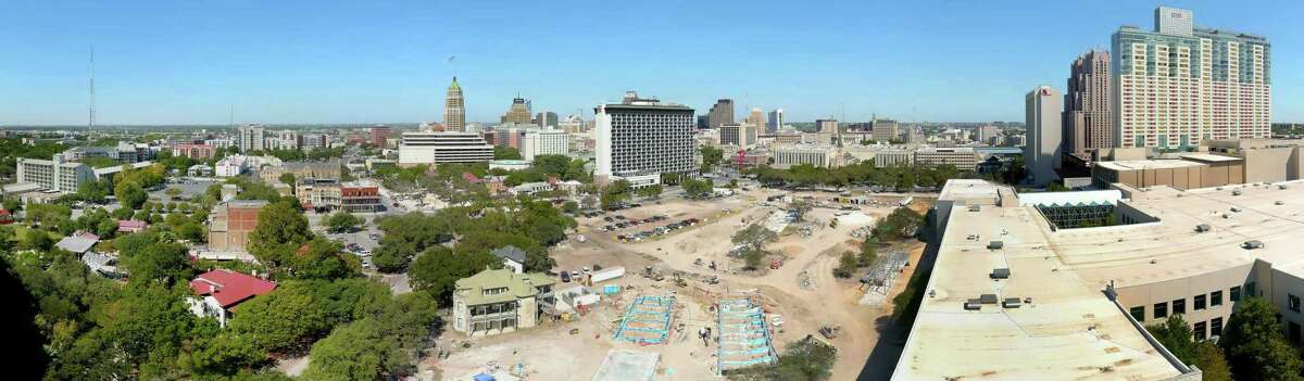 The under construction Hemisfair Civic Park in downtown is seen in a Tuesday, Sept. 27, 2022 aerial panorama photo created by stitching together 12 individual images. The two-story Halff House with the green roof is seen in the center foreground. The Hilton Palacio Del Rio hotel is seen in the center background. The Henry B. Gonzalez Convention Center is seen in the right foreground while the Grand Hyatt hotel is seen in the right background.