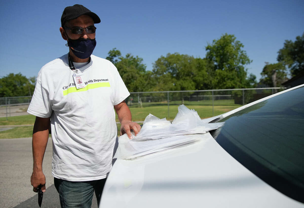 City of Houston Health Dept., employees pass out flyers from the EPA in neighborhoods where testing found dioxins in samples stemming from the Union Pacific rail yard on Thursday, Sept. 29, 2022 in Houston.