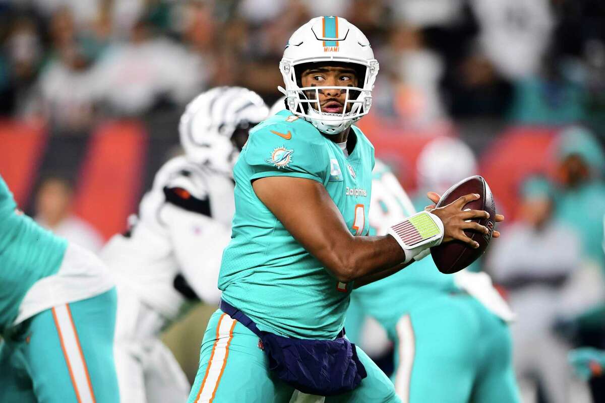 Miami Dolphins quarterback Tua Tagovailoa (1) drops back to pass during an NFL football game against the Cincinnati Bengals, Thursday, Sept. 29, 2022, in Cincinnati. (AP Photo/Emilee Chinn)