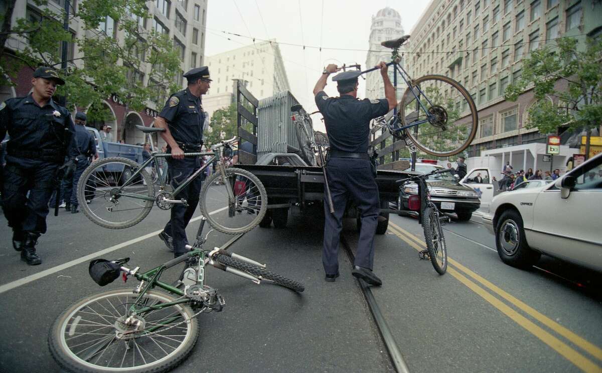 San Francisco Police confiscate bicycles and arrest bikers during a July 1997 Critical Mass ride.?