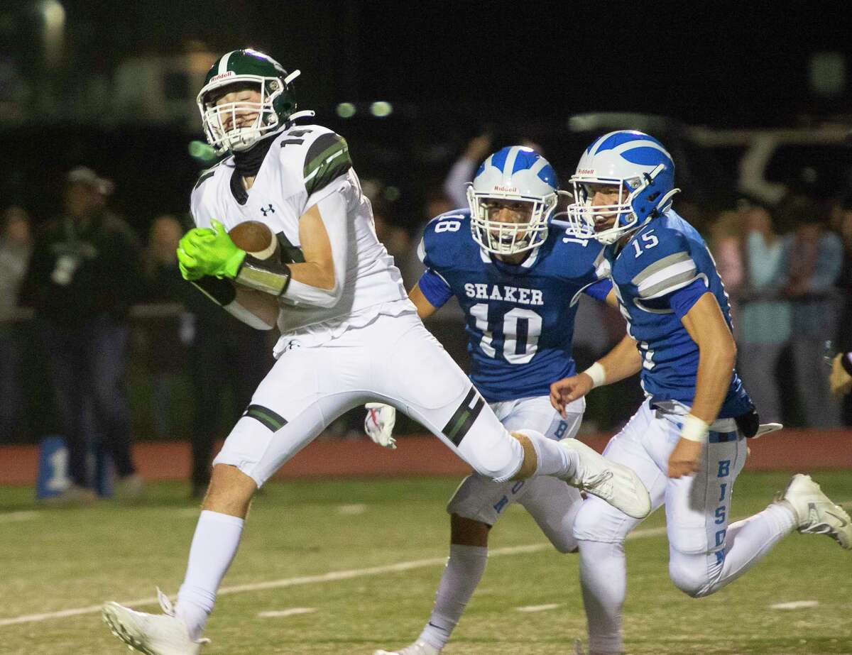 Shaker defense looks on as Shenendehowa wide receiver Luke McAuliffe catches a pass during a game in Latham, N.Y. on Friday, Sept. 30, 2022. (Jenn March, Special to the Times Union)