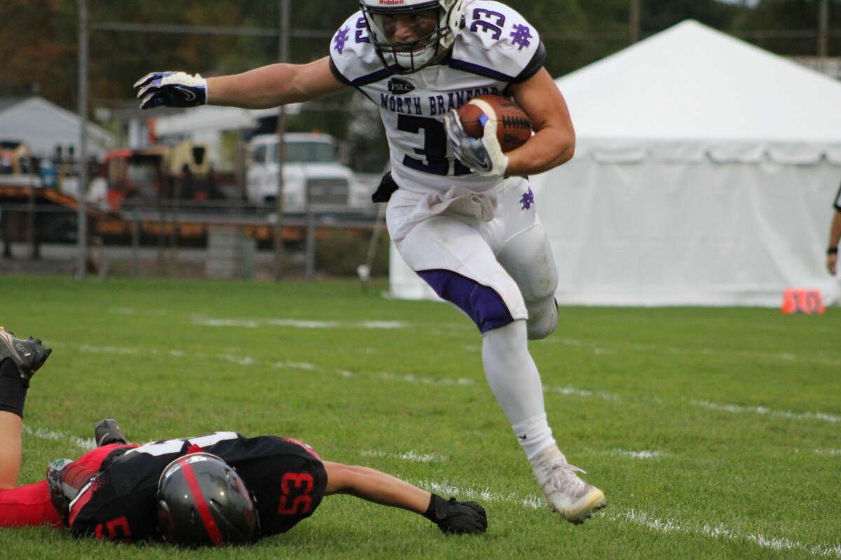 North Branford running back Tommy Hansen picks up two yards on his only carry of the game. Hansen was injured on the tackle three minutes into the Thunderbirds' 27-13 loss and did not return to action.