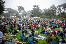 Festival goers listen to Sam Bush on the Banjo Stage at Hardly Strictly Bluegrass in Golden Gate Park in San Francisco on Sept. 30, 2022.