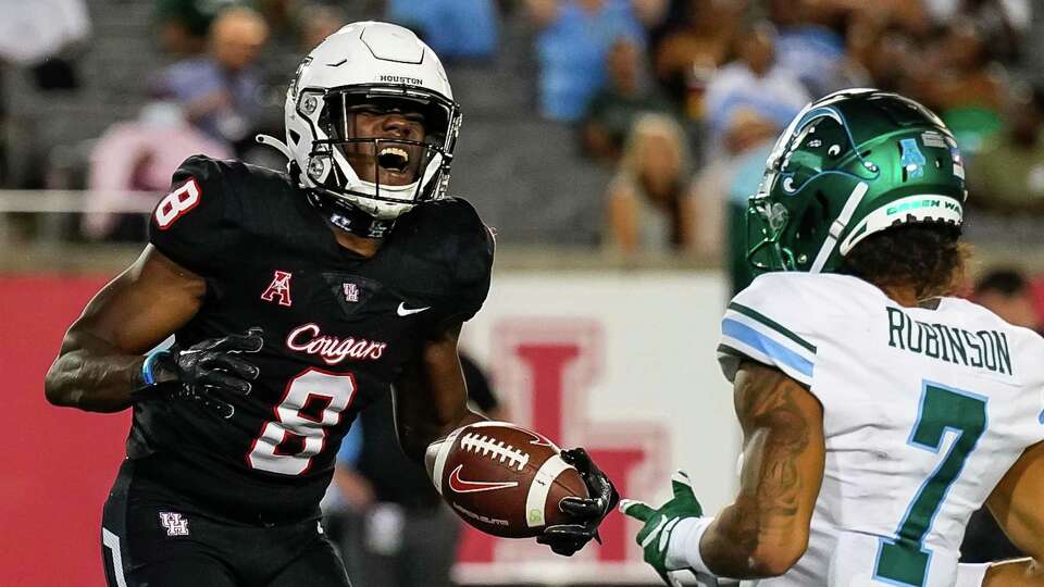 Houston wide receiver Kesean Carter (8) celebrates a first down reception that helped set up a touchdown that tied the game during the fourth quarter of an NCAA college football game Friday, Sept. 30, 2022, in Houston.