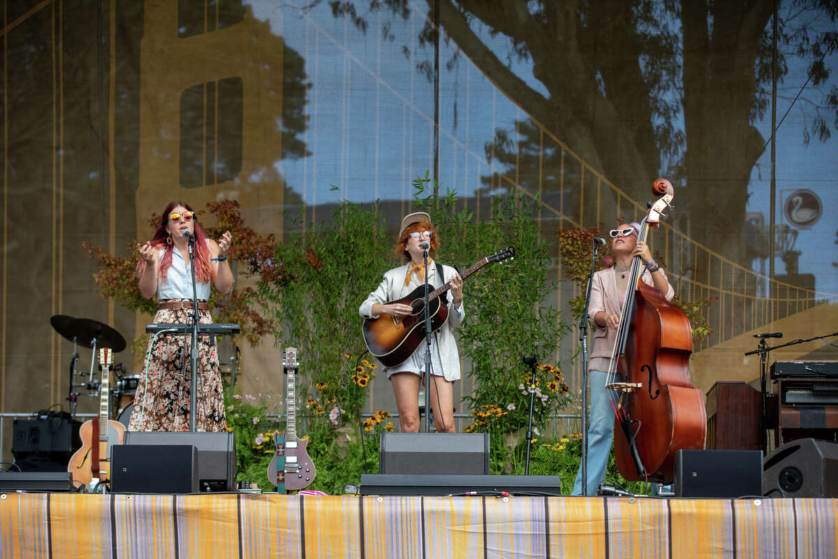 (L to R) Rainbow Girls' Erin Chapin, Caitlin Gowdey and Vanessa May perform on the Golden Tower Stage at Hardly Strictly Bluegrass in San Francisco's Golden Gate Park.  March 30, 2022.