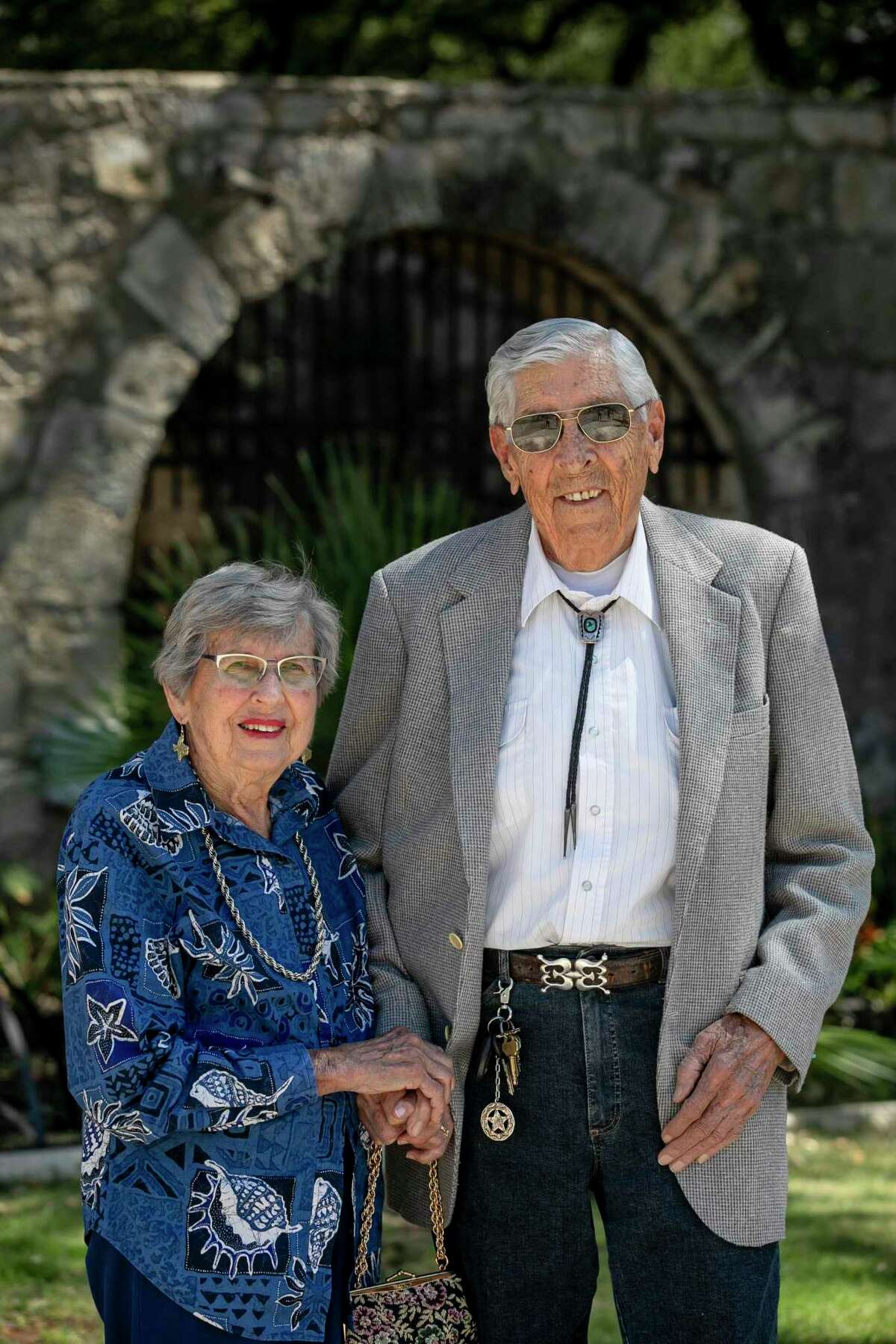 Longtime Bexar County collectors Louise and Donald Yena are pictured at the Alamo on Friday.