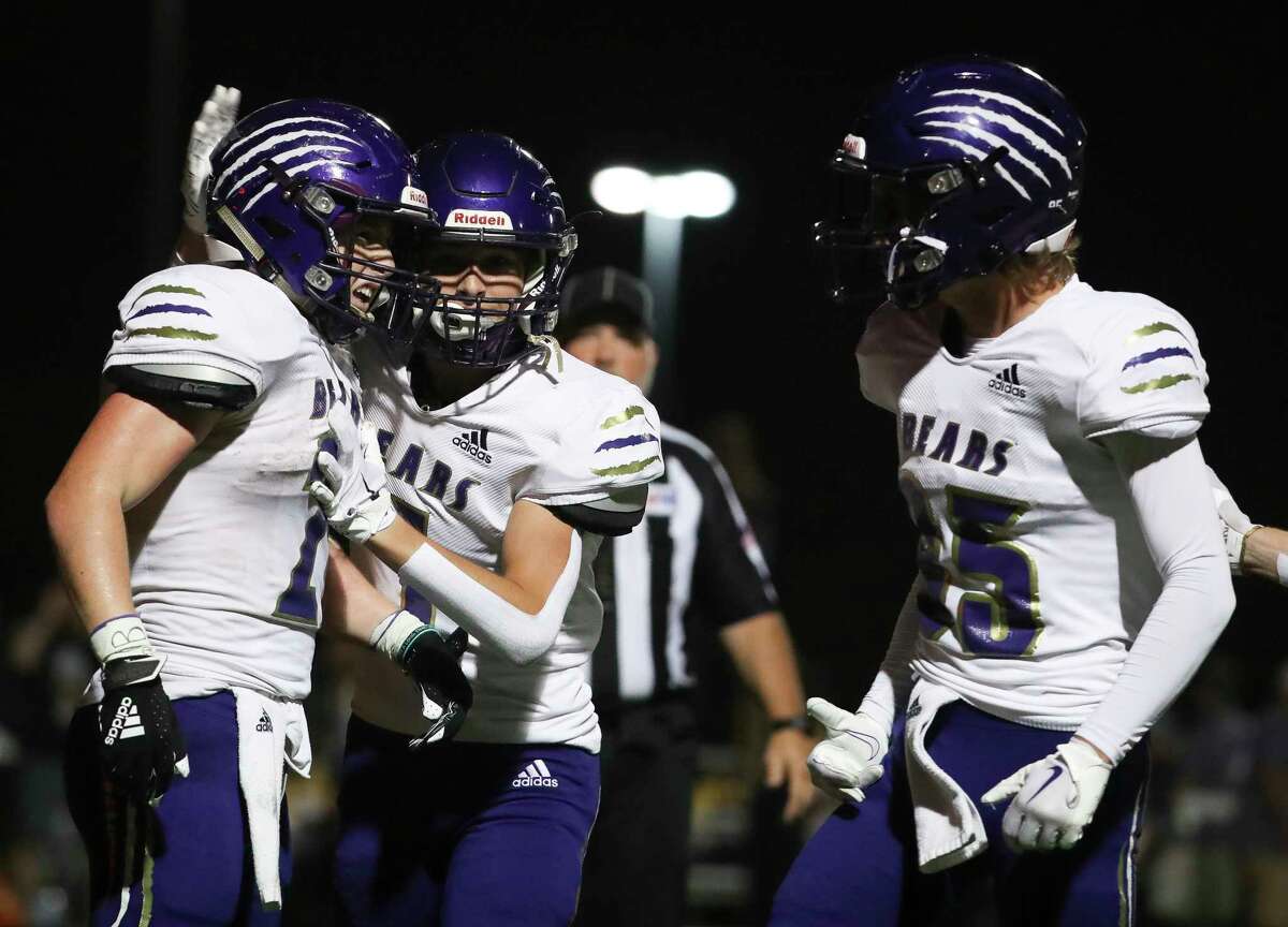 Montgomery wide receiver Justin Herman (21) celebrates with teammates after scoring a 22-yard touchdown in the second quarter of a District 10-5A (Div. II) high school football game at Montgomery ISD Stadium, Friday, Sept. 30, 2022, in Montgomery.