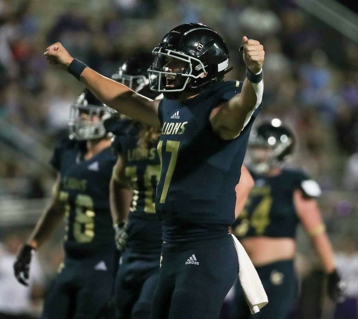 Lake Creek quarterback Cade Tessier (17) celebrates after throwing a 42-yard touchdown pass to wide receiver Sam Lee in the second quarter of a District 10-5A (Div. II) high school football game at Montgomery ISD Stadium, Friday, Sept. 30, 2022, in Montgomery.