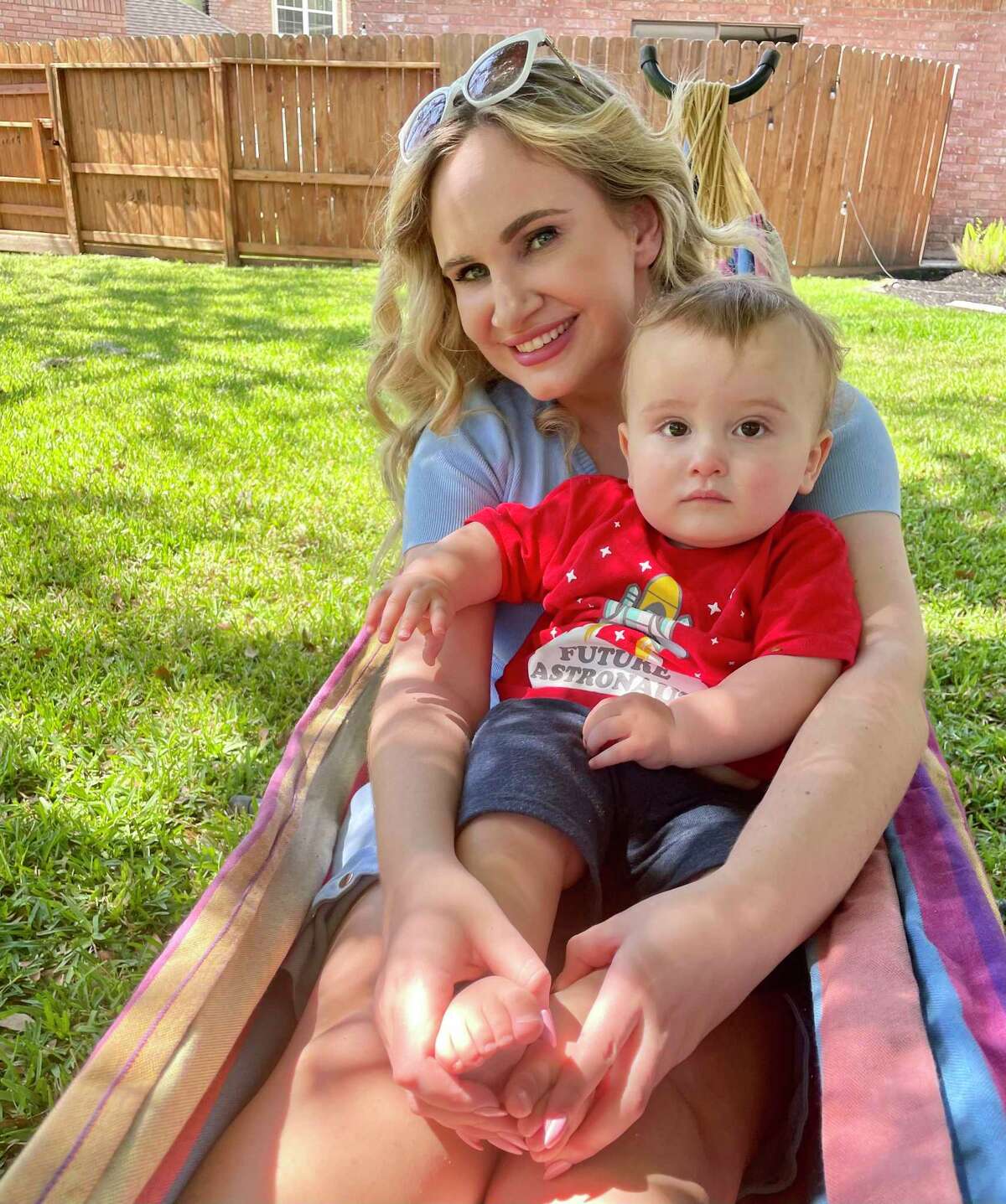 Elizabeth Markowitz, 28, poses with her 1-year-old son Asher. Markowitz recently moved to Texas from Alaska, and her history of miscarriage combined with uncertainty created by Texas anti-abortion law's vague emergency exception has led her to postpone having more children while living in the state.