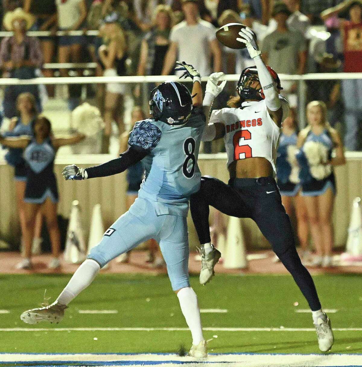 Johnson defender Shawn O’Gorman (8) breaks up an attempted touchdown pass to Brandeis receiver Jaden Perez (6) during high school football action at Comalander Stadium on Friday, Sept. 30, 2022.