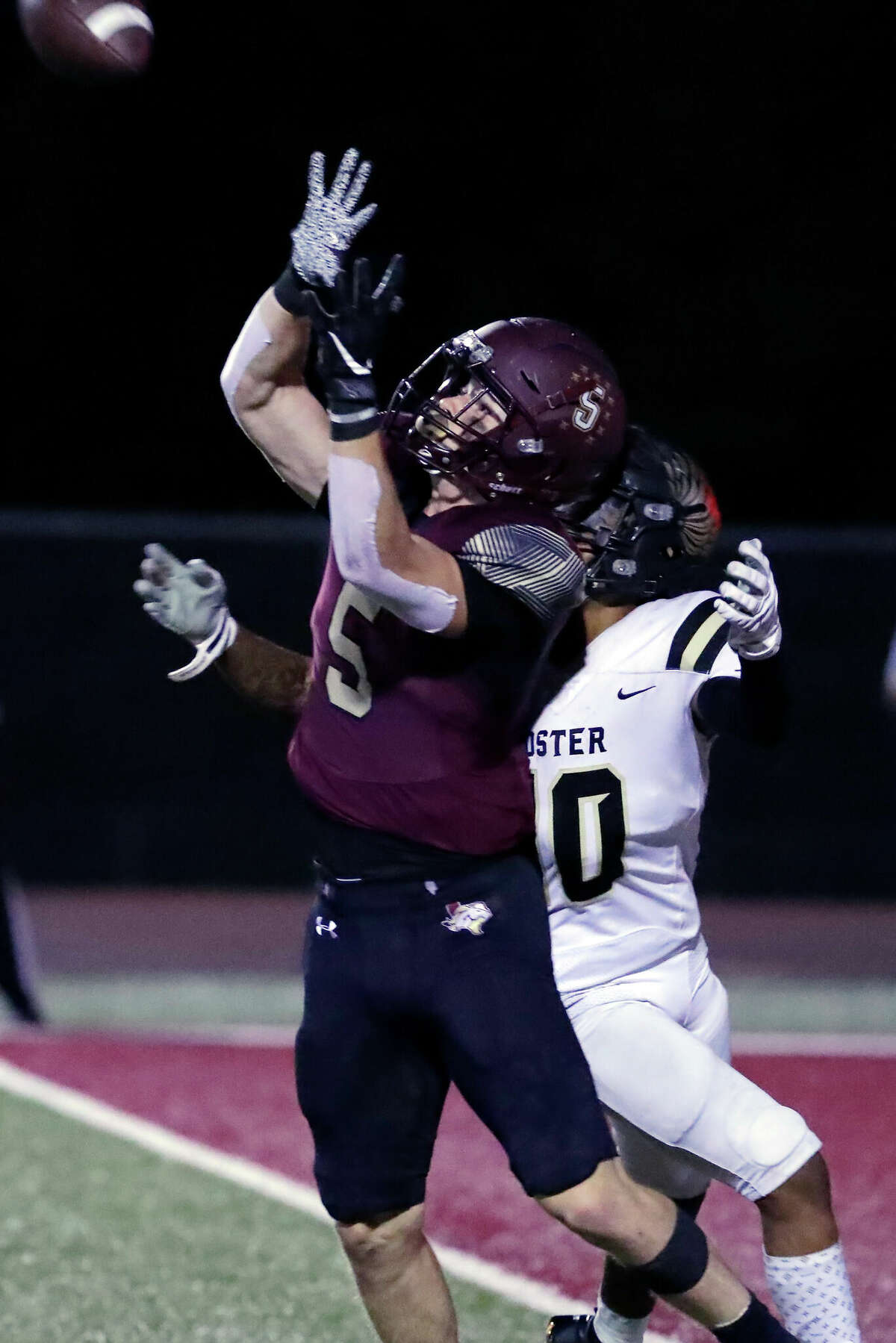 Magnolia West defensive back Jackson Blank goes up in front of Foster receiver Dylan Apponey to intercept the ball during the first half of their District 10-5A high school football game Friday, Sept. 30, 2022 in Magnolia TX.