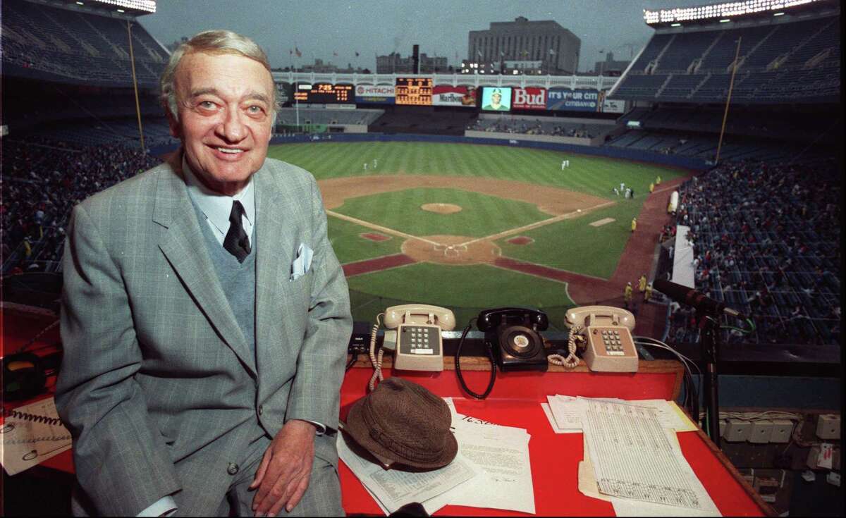 Longtime Greenwich resident Mel Allen in the broadcast booth at Yankee Stadium in New York in 1990.
