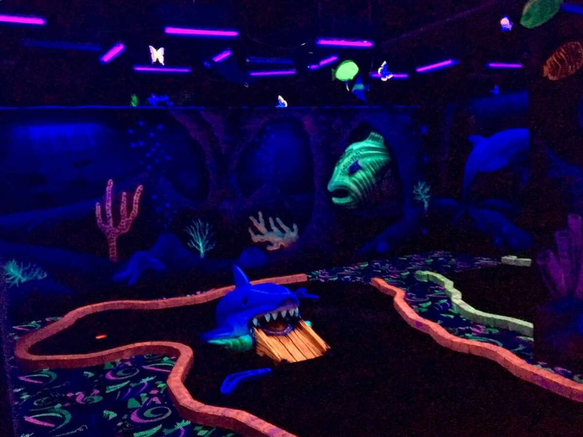 Shankz Golf features an underwater-themed blacklight mini-golf course.  The indoor entertainment center is at The Woodlands, just north of Houston.