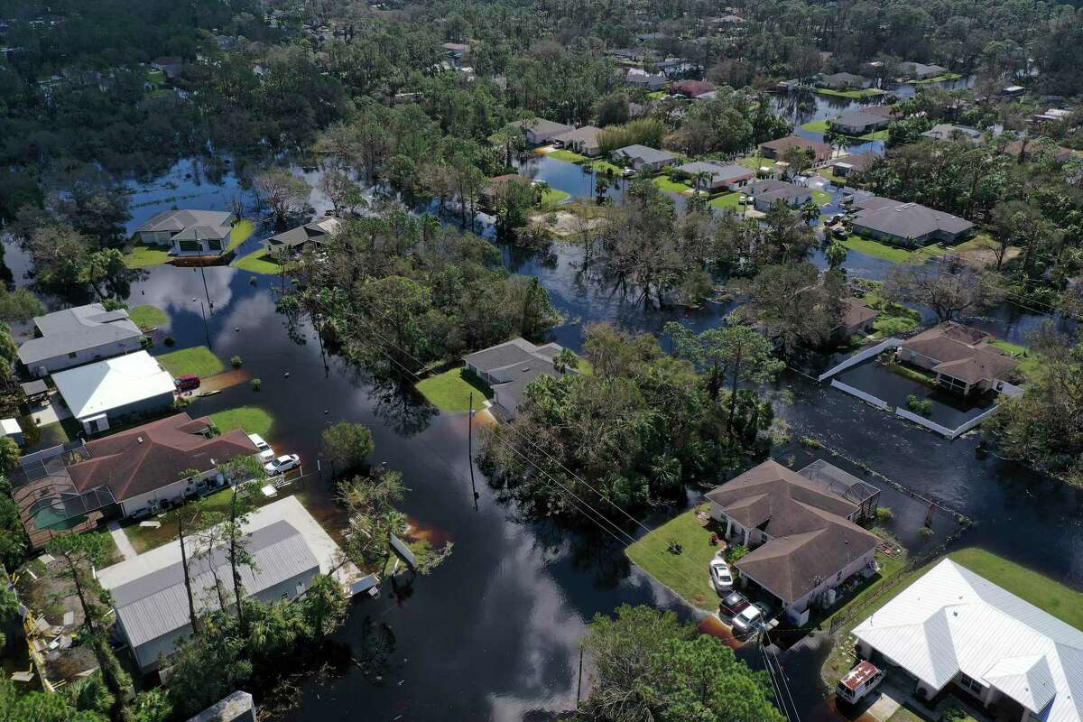 A North Port, Fla., neighborhood flooded by the rising Myakka River is shown Saturday, Oct. 1, 2022, in the wake of Hurricane Ian. The Category 4 hurricane brought high winds, storm surge and rain to the area causing severe damage.