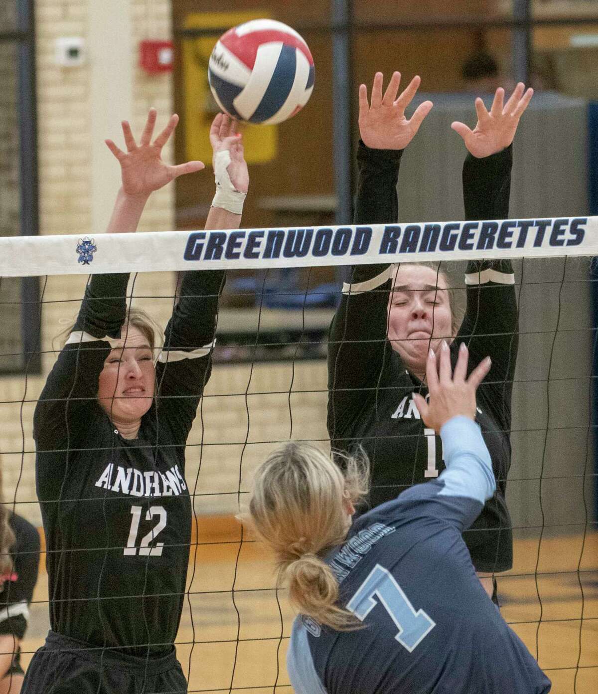 Andrews' Dee Mayfield and Jayci Richters go up for a block as Greenwood's Kirklyn Smith tries to hit past them 10/01/2022 Greenwood High gym. Tim Fischer/Reporter-Telegram