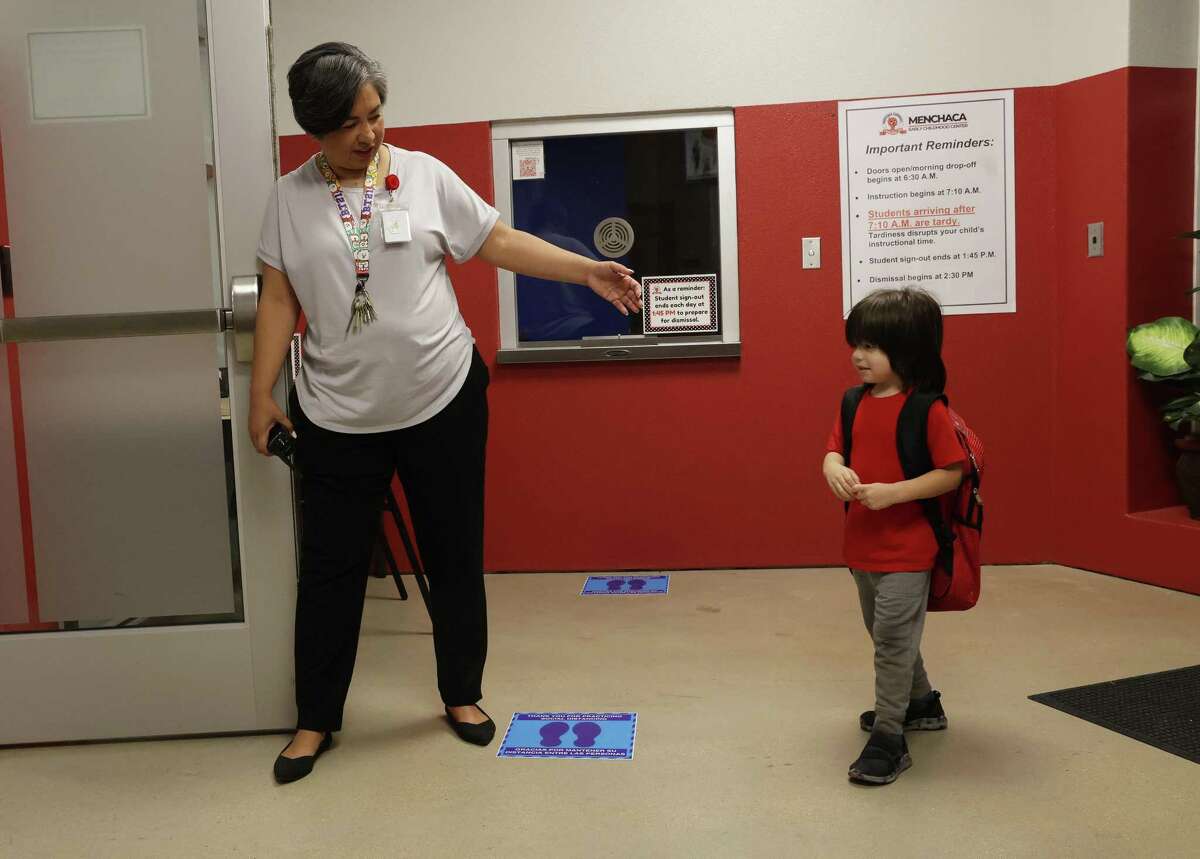 First-year principal Tanya Mares welcomes a pre-K student to Menchaca Early Childhood Center in Southside ISD on Thursday. Enrollment at Southside has continued to climb, even in pre-K, but other local districts saw a decline during the pandemic.