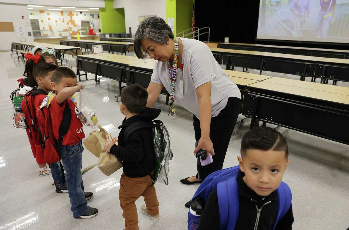 Principal Tanya Mares helps pre-K students line up at Southside ISD's Menchaca Early Childhood Center in September. Enrollment at Southside has continued to climb, even in pre-K, but other local districts saw a decline during the pandemic.