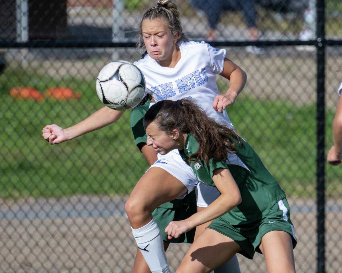 Shenendehowa senior Miranda DeMura gets a head on the ball in front of Columbia sophomore Kendyl Ouimette during a game at Shenendehowa High School on Saturday, Oct. 1, 2022. (Jim Franco/Special to the Times Union)