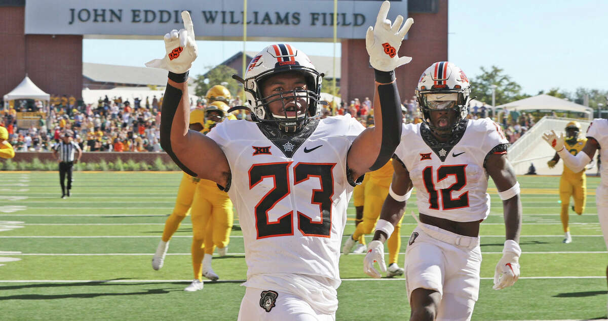 Oklahoma State running back Jaden Nixon celebrates his kickoff return for a touchdown against Baylor in the second half in an NCAA college football game, Saturday, Oct. 1, 2022, in Waco, Texas. Oklahoma State defeated Baylor 36-25. (Rod Aydelotte/Waco Tribune-Herald, via AP)