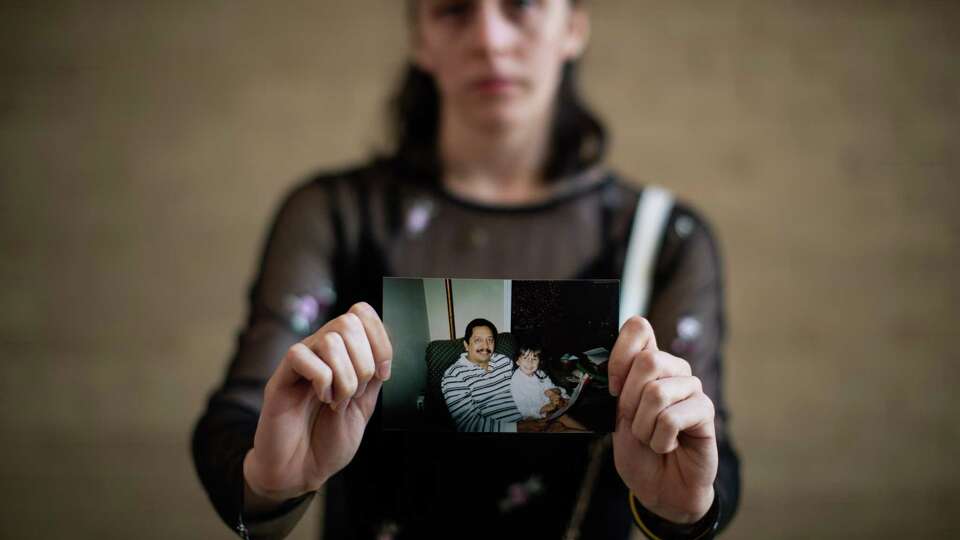 Vanessa Zambrano holds a photo of her with her father Alirio Zambrano, who is one of the Citgo 6 detained in Venezuela. Friday, April 1, 2022, in Houston.