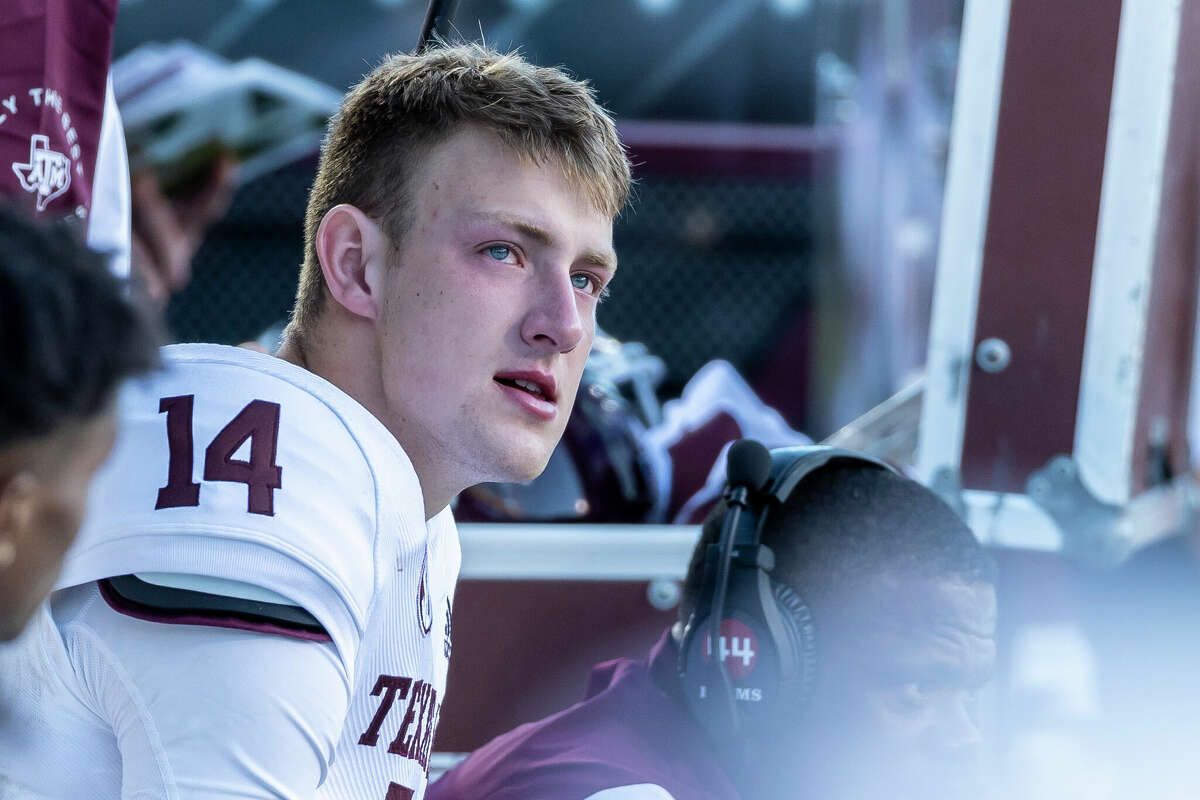 Texas A&M quarterback Max Johnson (14) looks on from the bench after exiting the game during an NCAA football game against Mississippi State, Saturday, Oct. 1, 2022, in Starkville, Miss.