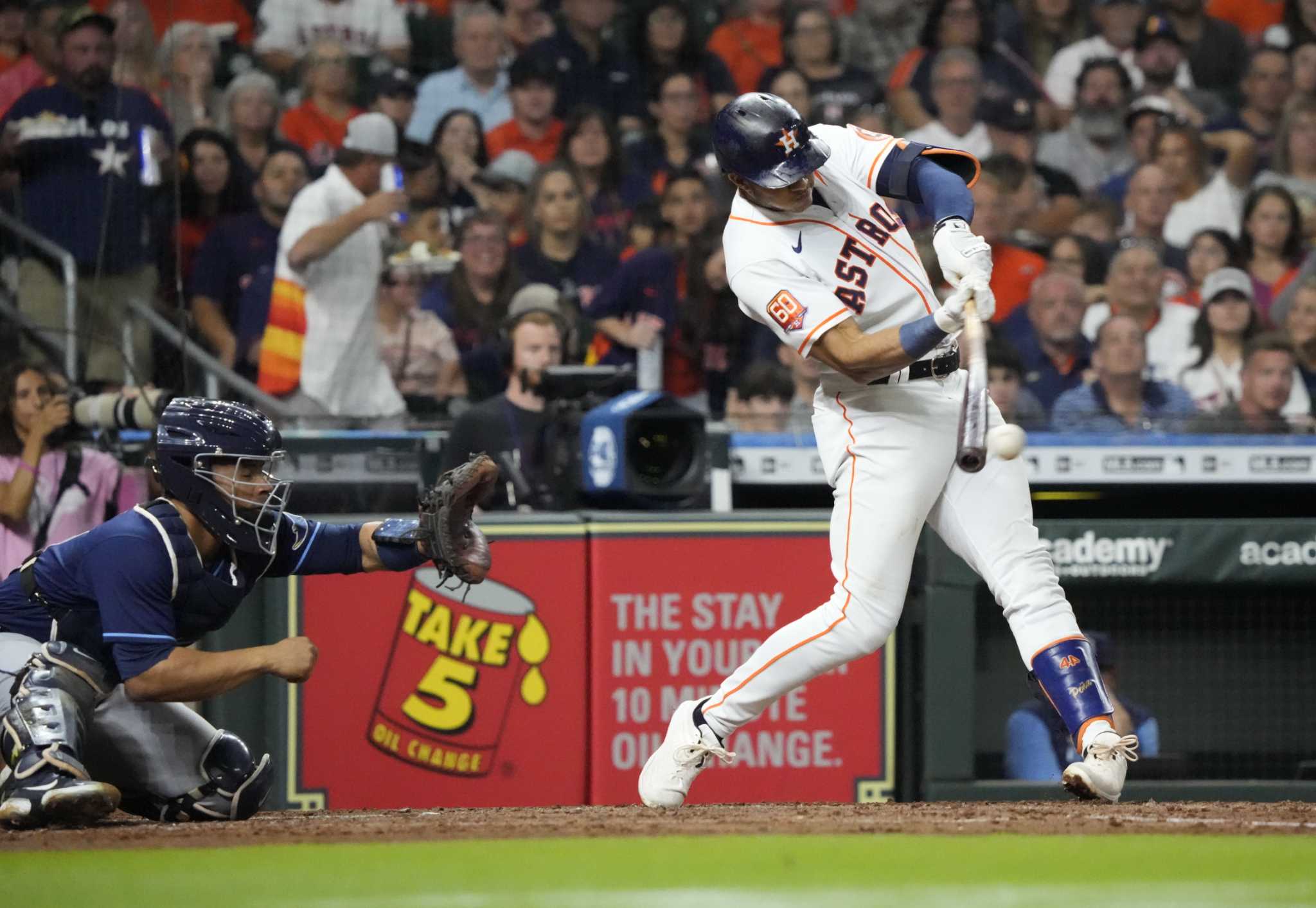 Houston Astros' Jeremy Pena watches his hits an RBI single during