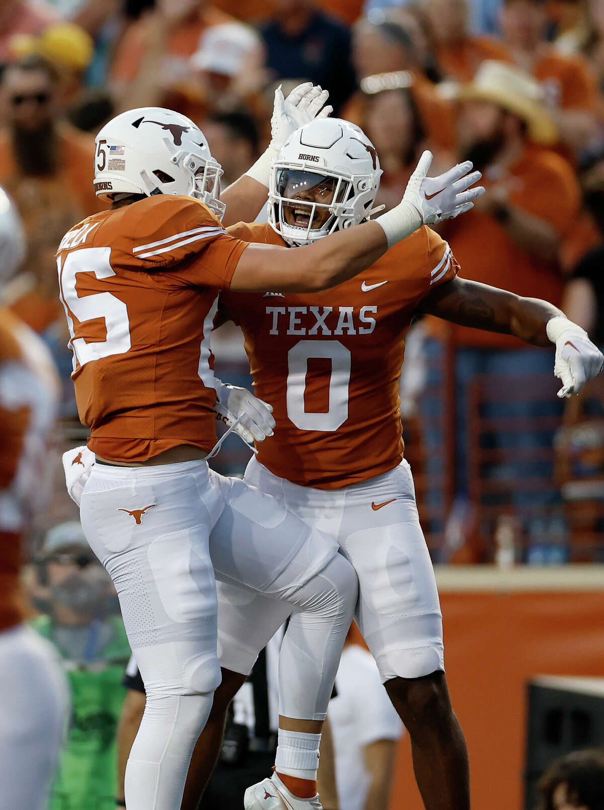 AUSTIN, TEXAS - OCTOBER 01: Gunnar Helm #85 of the Texas Longhorns celebrates with Ja'Tavion Sanders #0 after a touchdown reception in the first half against the West Virginia Mountaineers at Darrell K Royal-Texas Memorial Stadium on October 01, 2022 in Austin, Texas. (Photo by Tim Warner/Getty Images)