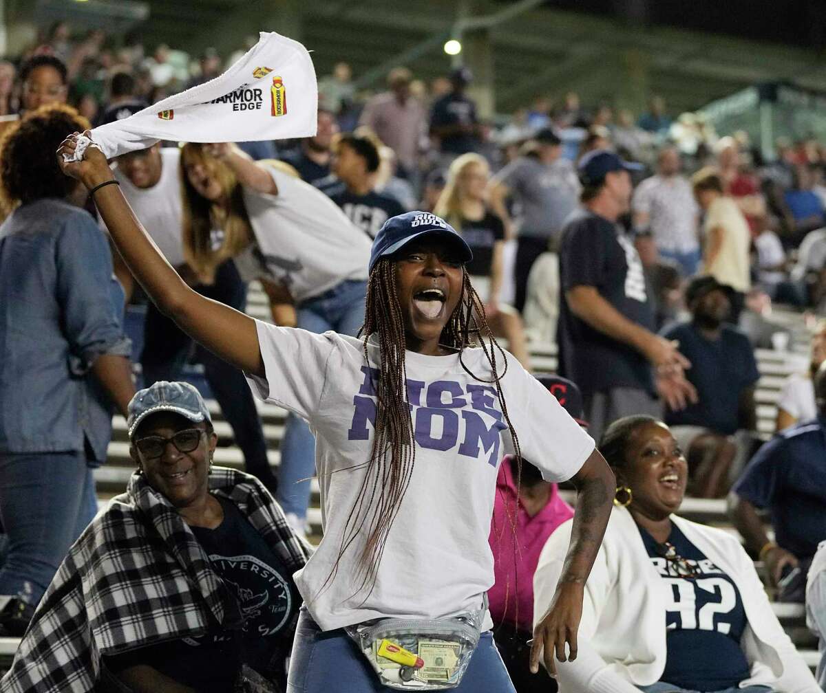 A Rice fan celebrates after the Owls scored a defensive touchdown to take the lead in the third quarter of a football game against the UAB Blazers in Houston, Saturday, Oct. 1, 2022.