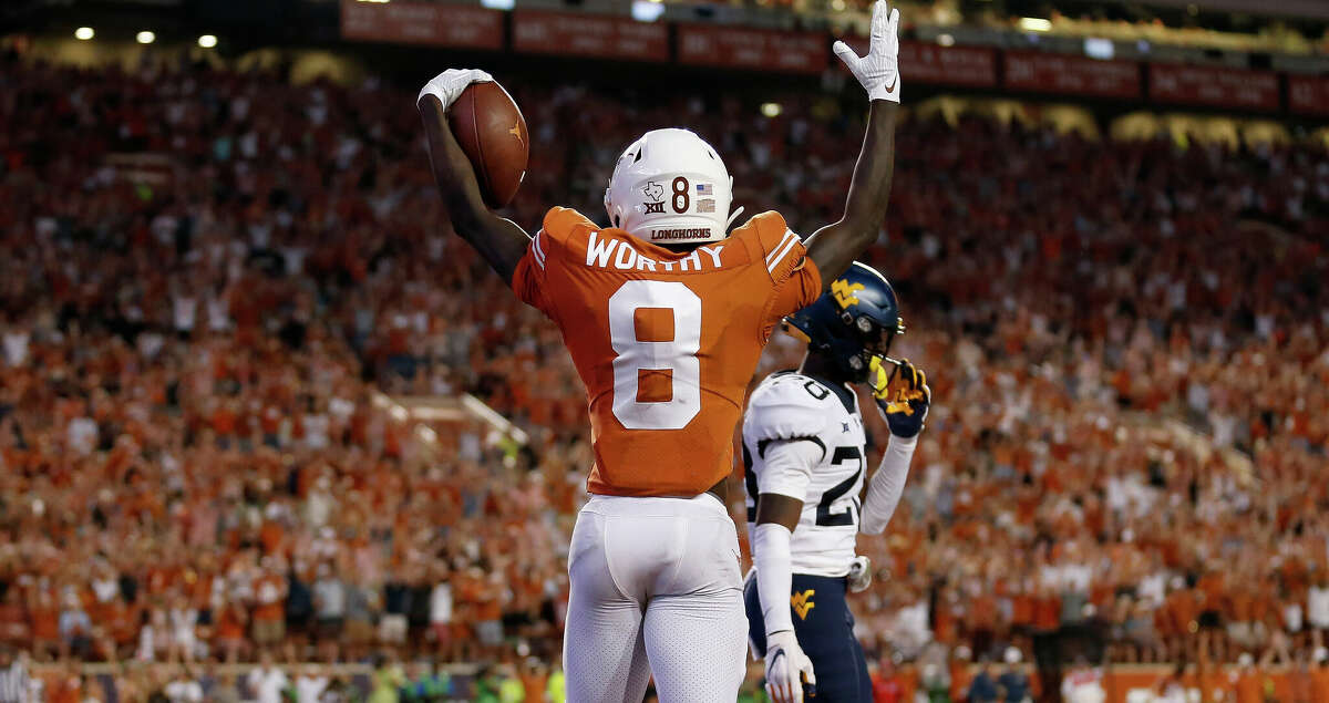 AUSTIN, TEXAS - OCTOBER 01: Xavier Worthy #8 of the Texas Longhorns reacts after a touchdown reception in the second half against the West Virginia Mountaineers at Darrell K Royal-Texas Memorial Stadium on October 01, 2022 in Austin, Texas. (Photo by Tim Warner/Getty Images)