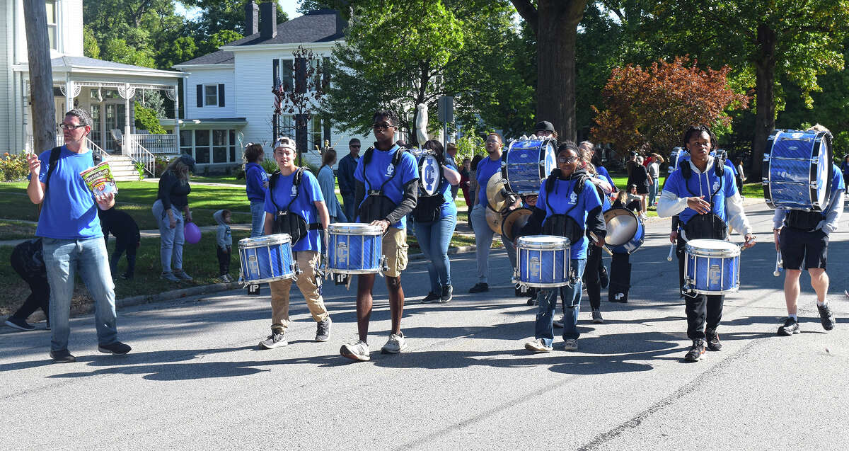 The Illinois College drumline keeps the beat for nearby marchers as the college's homecoming parade makes its way through the streets of Jacksonville.