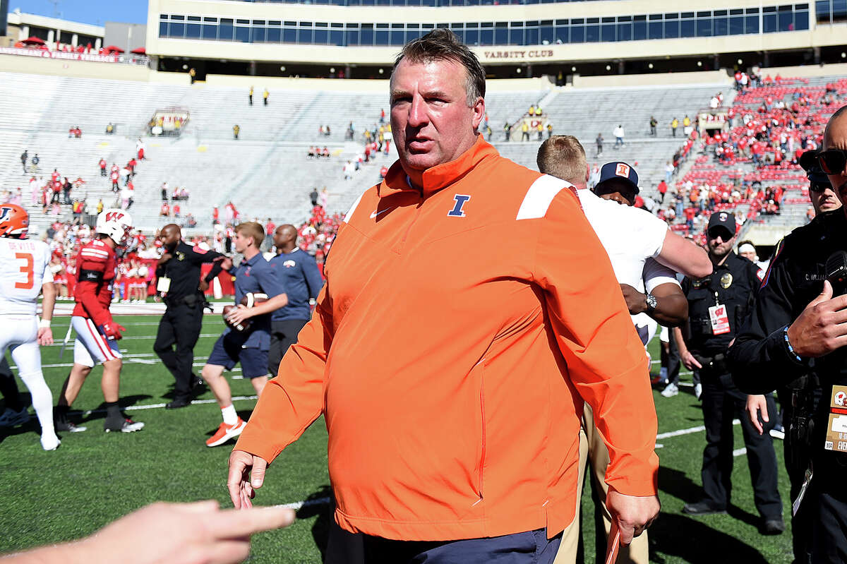 Illinois head coach Bret Bielema walks off the field following a 34-10 win over Wisconsin Saturday in Madison, Wis. \