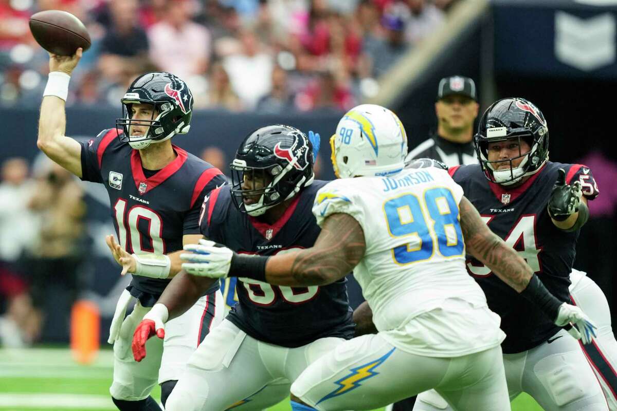 Houston Texans quarterback Davis Mills (10) passes against the Los Angeles Chargers during the second quarter of an NFL football game Sunday, Oct. 2, 2022, in Houston.