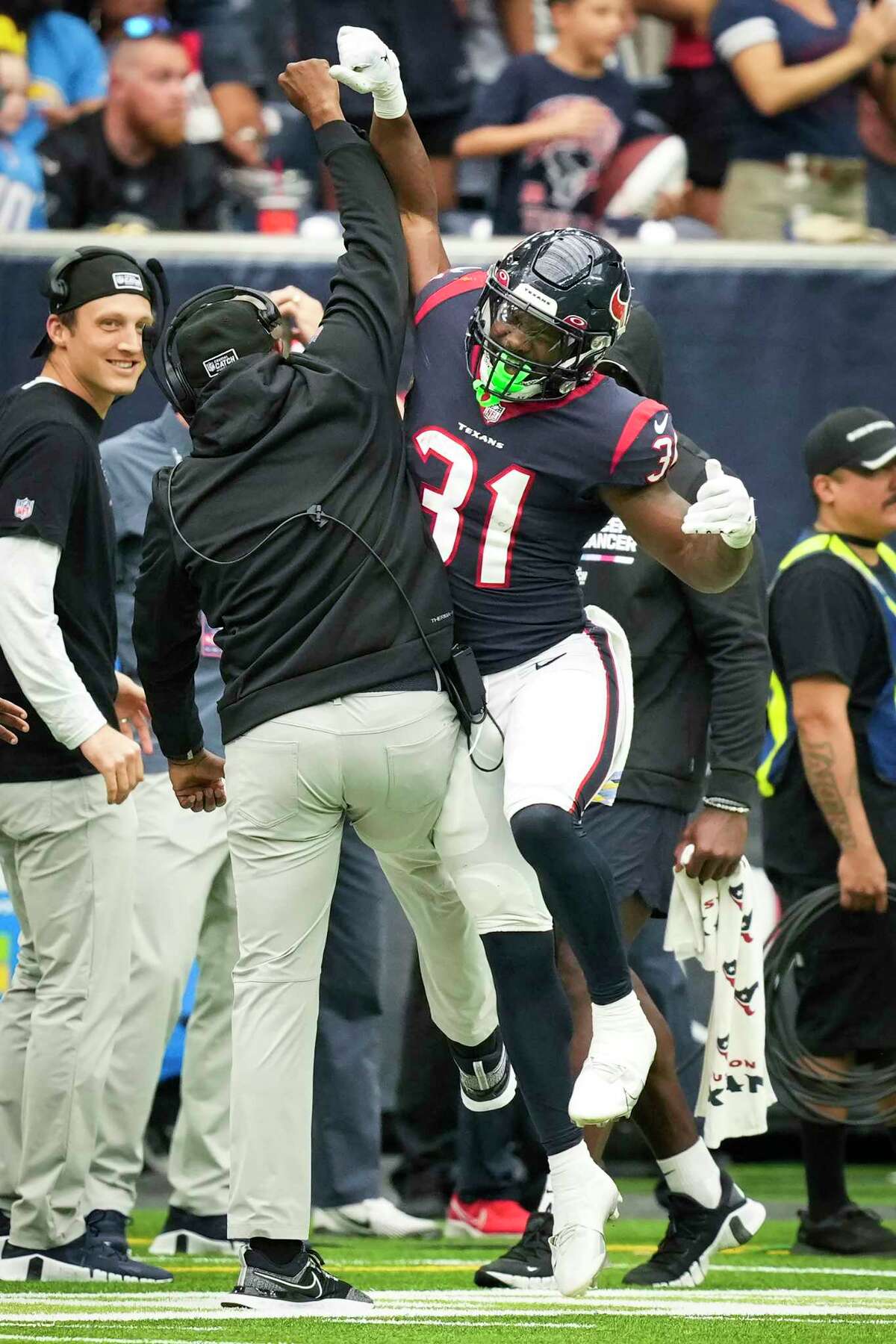 Houston Texans wide receiver John Metchie III (88) catches a pass and  breaks away for a firs down in the third quarter of the NFL Football Game  between the Los Angeles Chargers