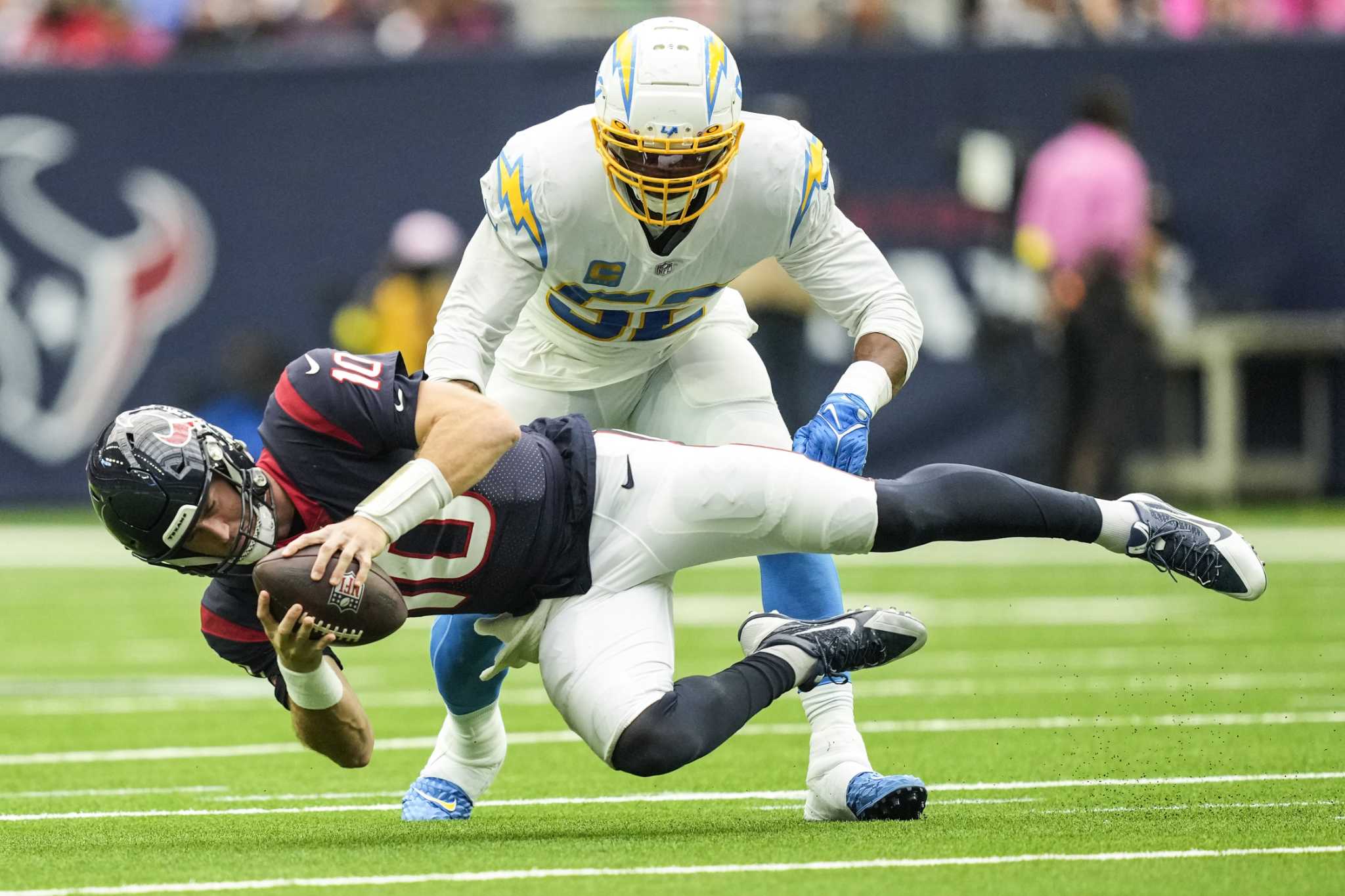 Los Angeles Chargers linebacker Chris Rumph II (94) tackles Los