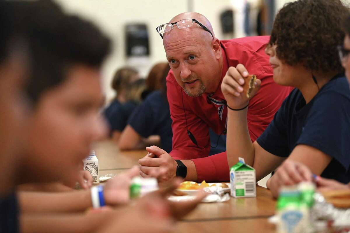Principal Lester Eastman talks to students during their lunch break at Fox Creek Junior High School on Sept. 14, 2022 in Bullhead City, Ariz. (