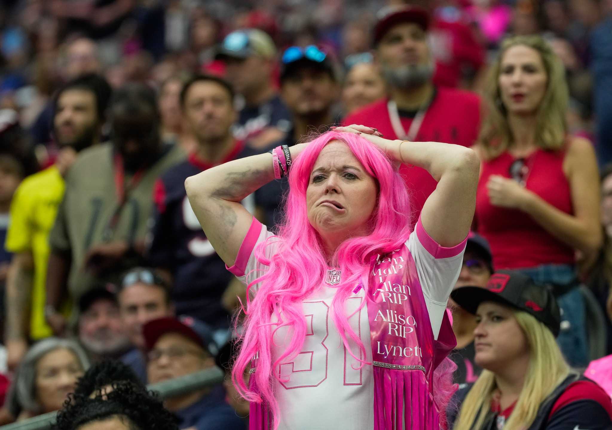 Houston Texans fans cheer in the stands during the second half of