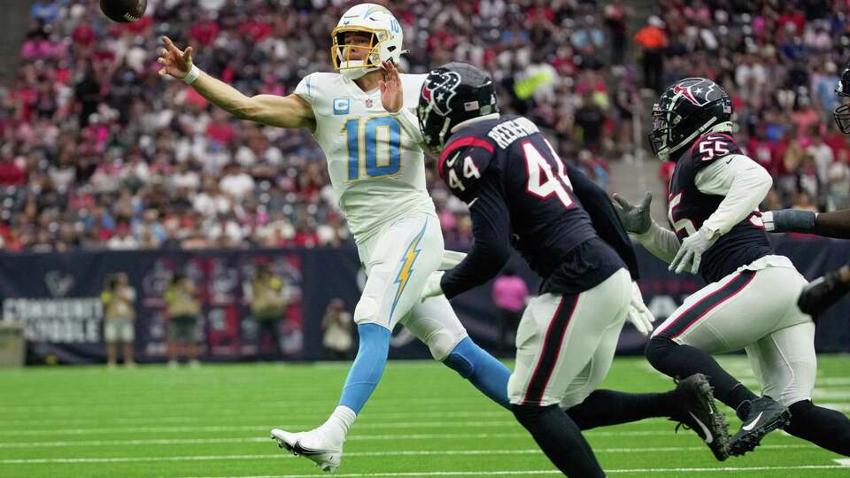 Los Angeles Chargers quarterback Justin Herbert (10) throws a pass during the second quarter of the NFL game against the Houston Texans Sunday, Oct. 2, 2022, at NRG Stadium in Houston.