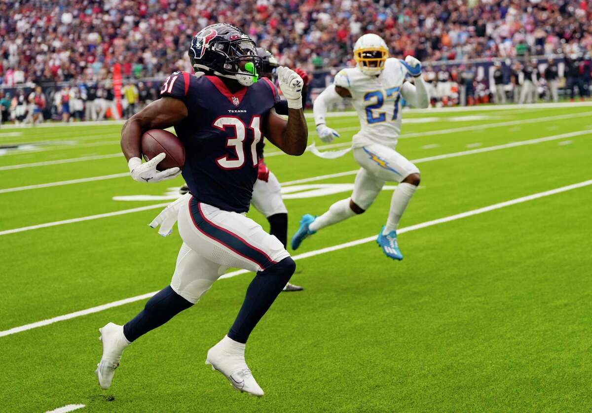 Houston Texans running back Dameon Pierce (31) runs for a touchdown against the Los Angeles Chargers during the first half of an NFL football game Sunday, Oct. 2, 2022, in Houston.