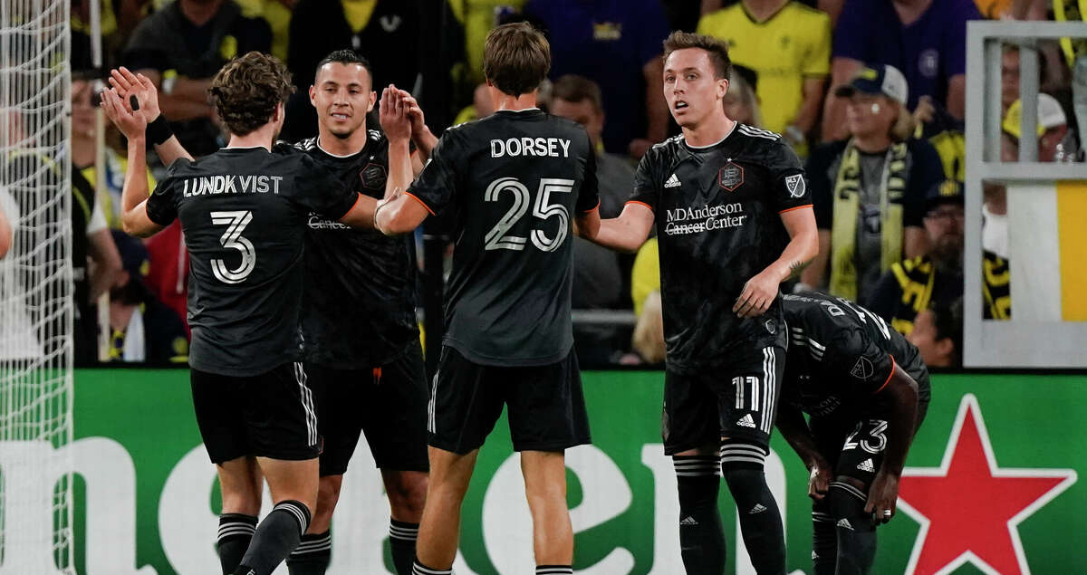 Houston Dynamo's Sebastian Ferreira, second from left, is congratulated after scoring a goal against Nashville SC during the first half of an MLS soccer match Sunday, Oct. 2, 2022, in Nashville, Tenn. (AP Photo/Mark Humphrey)