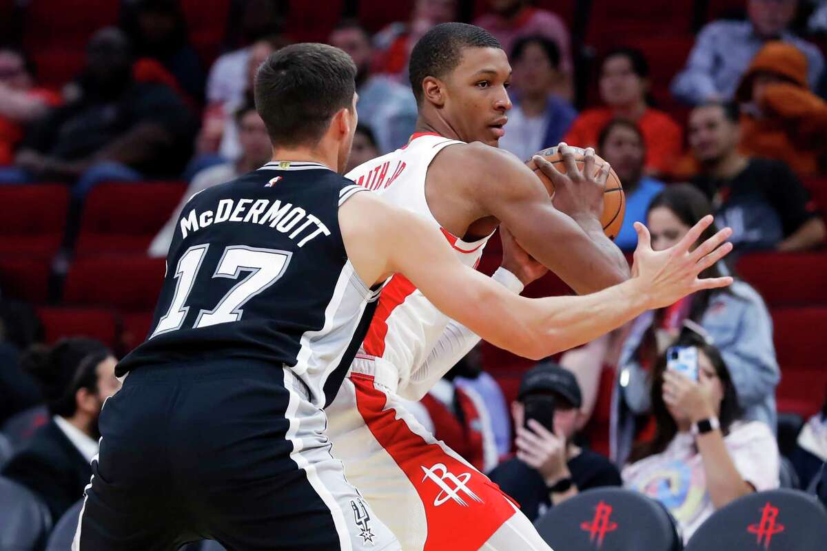 Houston Rockets forward Jabari Smith Jr., passing against the Spurs, will be out for Friday's preseason game against Toronto because of a sore ankle.