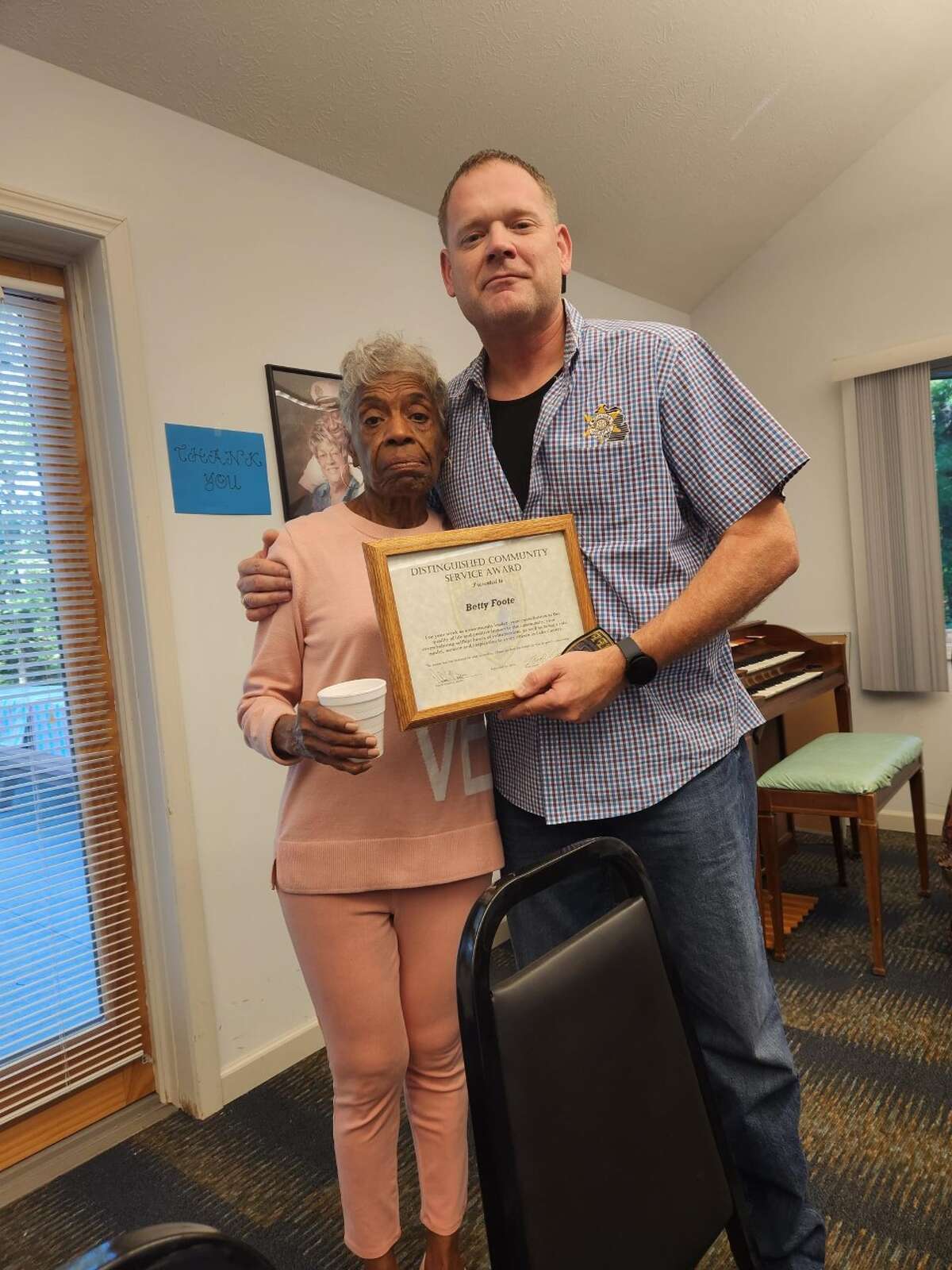 Lake County Sheriff Rich Martin presented Betty Foote, director of the Henrietta Senior Center, a Distinguished Community Service Award recently.