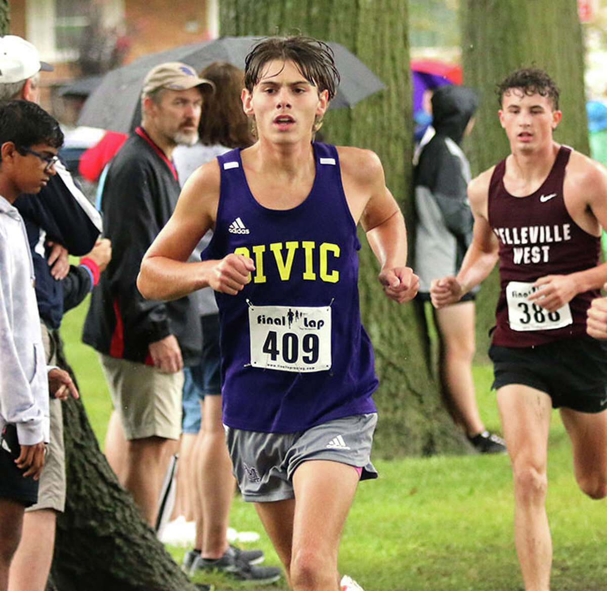 CM's D.J. Dutton (409) runs in the rain at the Granite City Invite on Sept. 3. Dutton the fastest time of career Saturday at the Peoria Invite at Detweiller Park.